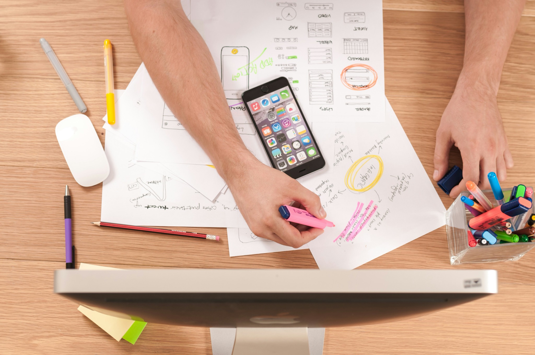 Marketing planning and UX notes on a desk